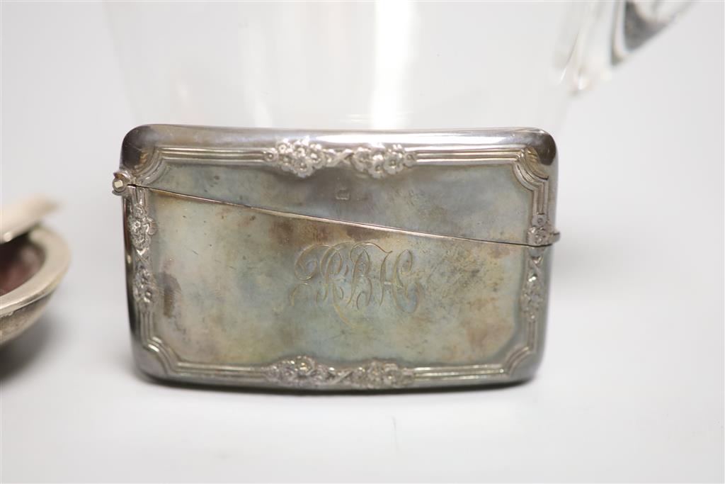 A late Victorian silver mounted glass decanter and stopper, London, 1893, 21.5cm, a silver card case and an ashtray.